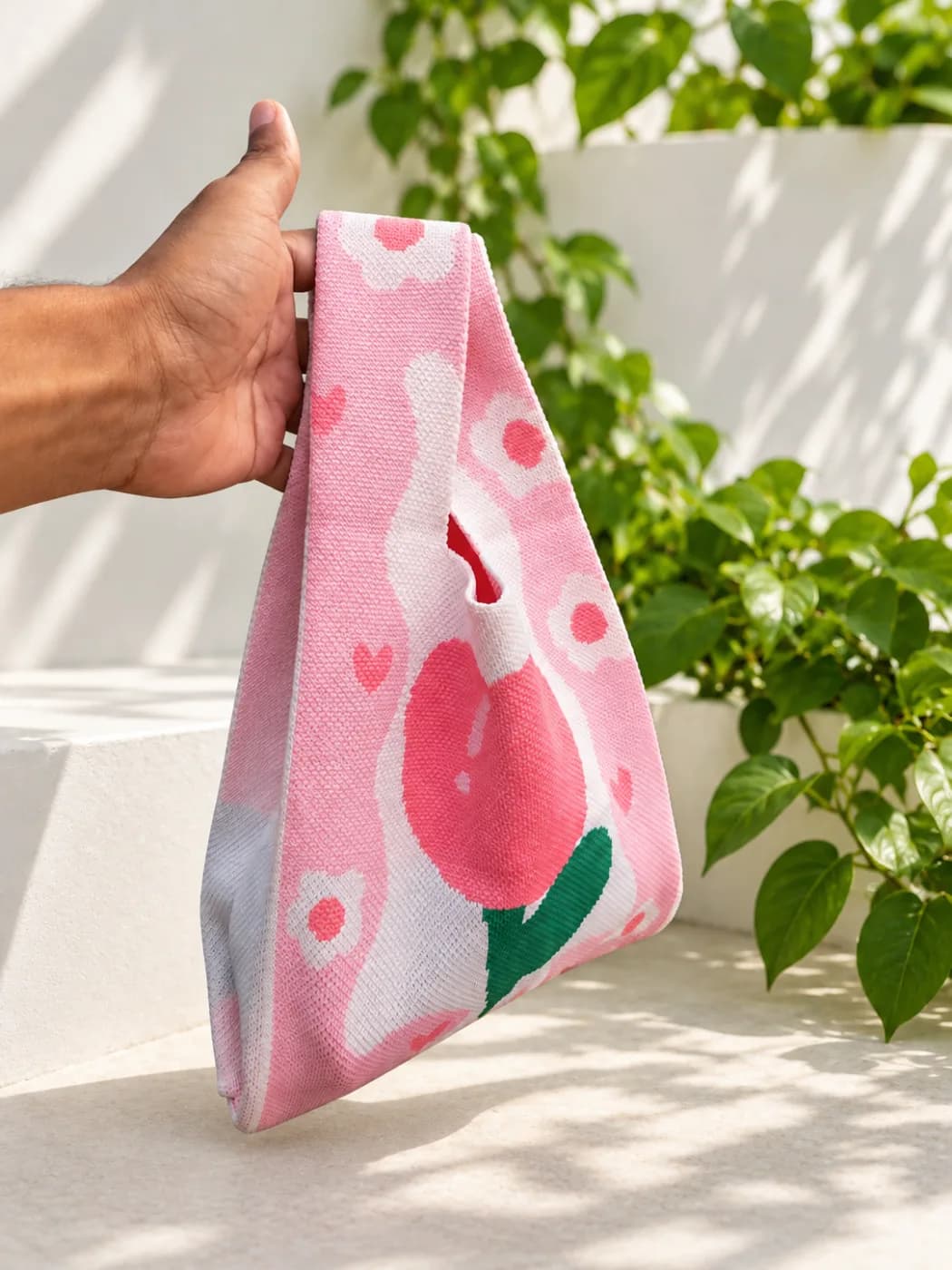 Pink Lily knotted wristlet bag